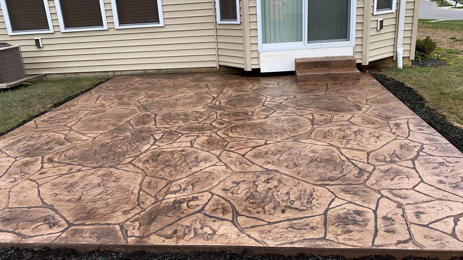 Wood-plank stamped concrete patio